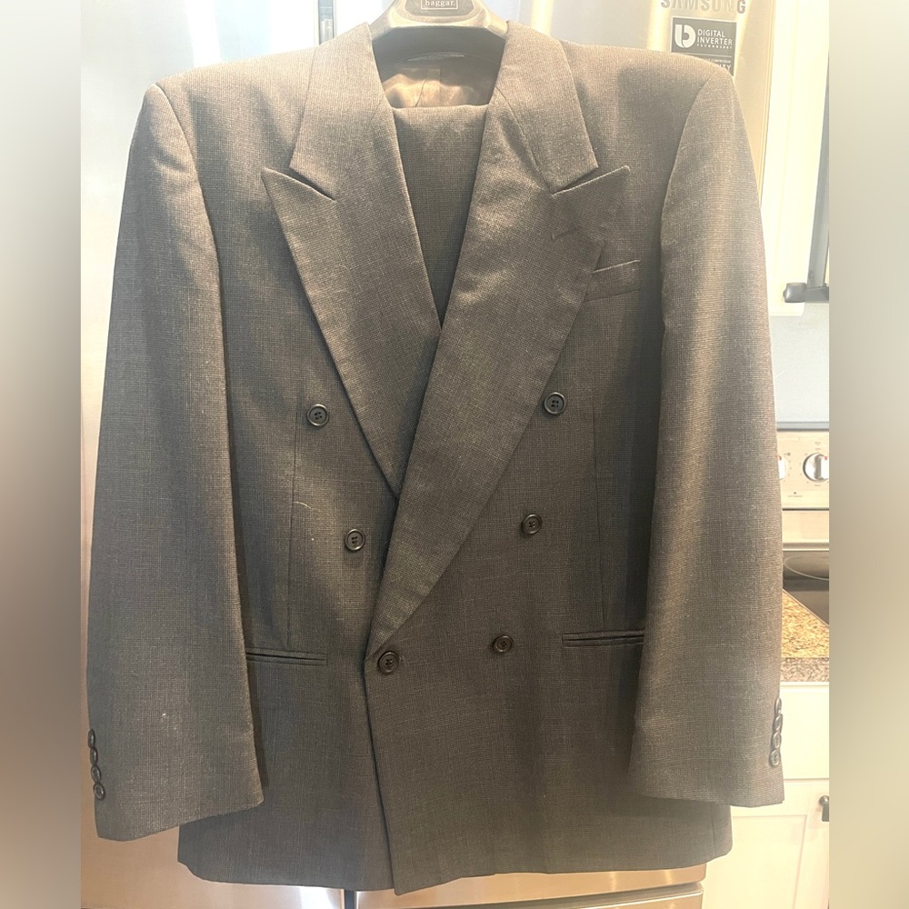 Mens gray suit jacket with matching trousers.